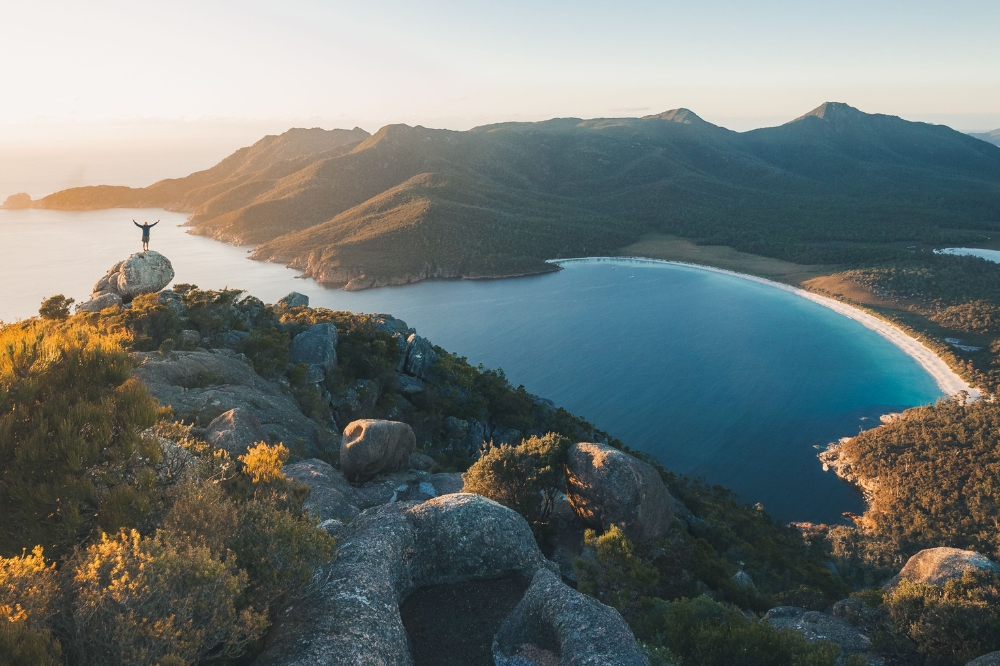 The view of wineglass bay from above with blue water and white sand